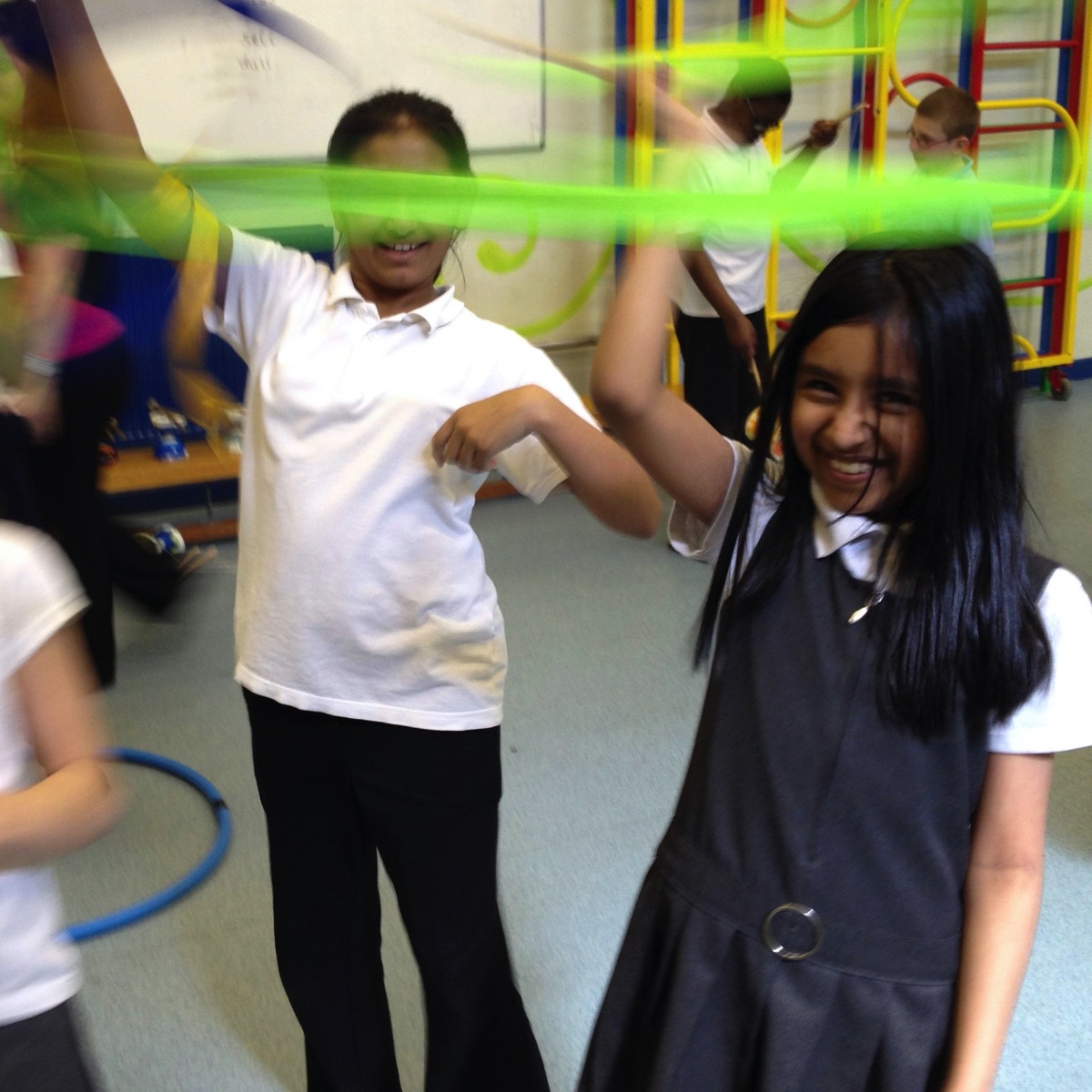 Children enjoying a Circus Skills workshops in the school hall