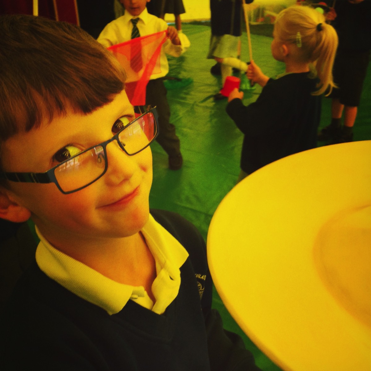 Plate spinning at a circus skills workshop for schools