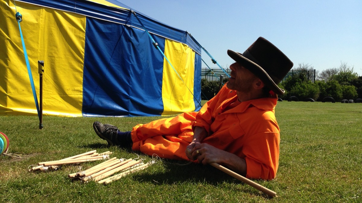 Relaxing outside our Big Top during a break in performances at a Circus day in a school